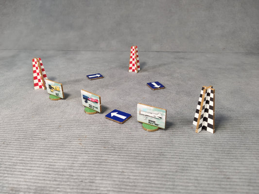 Set of miniature race track obstacles on a gray surface