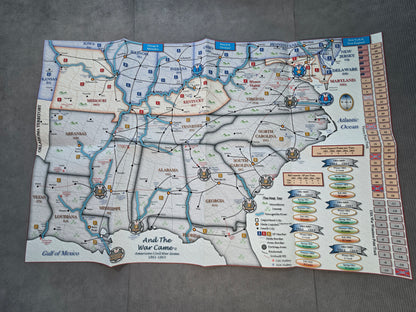 A vintage-style military campaign map poster titled 'And The War Came' laid flat on a gray textured surface. The map features detailed geographical illustrations of the American South and surrounding regions, with colored labels, borders, and a vertical column of colored rectangles on the right side.