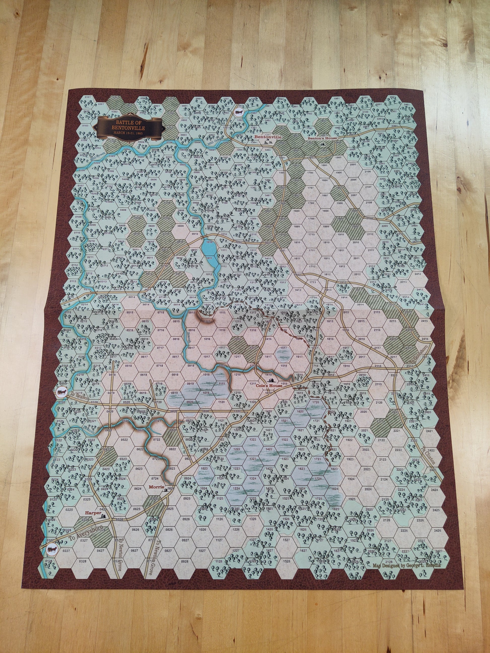 Hexagonal tile map on a wooden floor