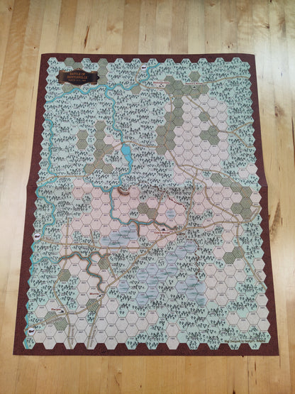 Hexagonal tile map on a wooden floor