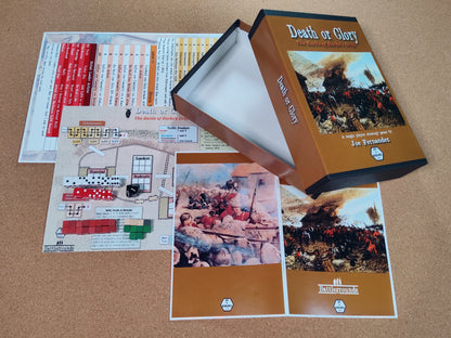 Board game components including a box, cards, and printed materials on a brown surface.