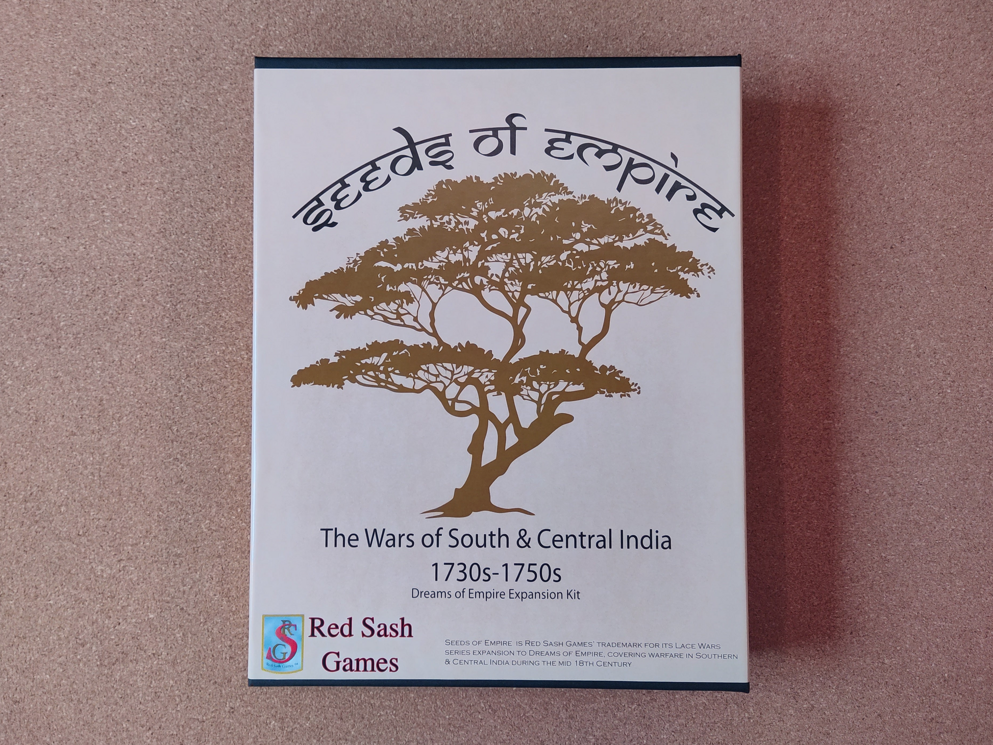 Board game box titled 'Seeds of Empire' by Red Sash Games on a brown background.