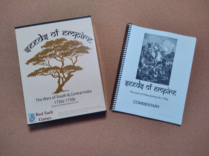 A box of 'Seeds of Empire' and its historical commentary booklet sit on a brown surface.